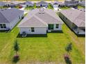 Aerial view of the home's backyard and surrounding landscape at 219 Summerlin Loop, Haines City, FL 33844