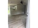 Bright and airy living room with wood-look flooring at 1111 N Hart Blvd, Orlando, FL 32818