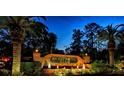 Illuminated Sweetwater Club entrance with fountains at 202 Sweetwater Club Blvd, Longwood, FL 32779