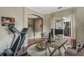 Home office with hardwood floors, a workspace, and a treadmill at 11542 Brightstowe Way, Orlando, FL 32836