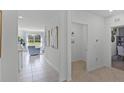Spacious hallway with tile flooring and views into other rooms at 2638 Sage Valley Way, Winter Haven, FL 33884
