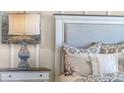 Close up of Primary bedroom with king bed and night stand at 2634 Sage Valley Way, Winter Haven, FL 33884
