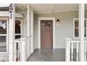 House exterior featuring a brown front door and porch at 4221 Mizell St, Orlando, FL 32812