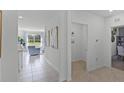 Bright hallway with tile flooring, leading to living areas and bedrooms at 2622 Sage Valley Way, Winter Haven, FL 33884