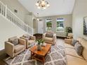 Spacious living room with hardwood floors and ample natural light at 10472 Eastpark Lake Dr, Orlando, FL 32832