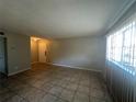 Bright living room with tile flooring and neutral walls at 5505 Hernandes Dr # 238, Orlando, FL 32808