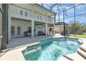 Inviting kidney-shaped pool with a screened enclosure at 15543 Pebble Ridge St, Winter Garden, FL 34787