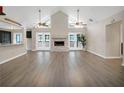 Bright living room with hardwood floors and fireplace at 500 Teacup Springs Ct, Winter Garden, FL 34787