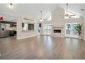 Open living room with kitchen and fireplace at 500 Teacup Springs Ct, Winter Garden, FL 34787