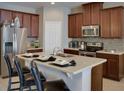 Modern kitchen with stainless steel appliances and an island at 159 Aulin Ave, Oviedo, FL 32765