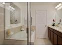 Main bathroom boasts a soaking tub, double vanity, and glass shower at 159 Aulin Ave, Oviedo, FL 32765