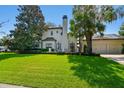 House exterior showcasing a classic design with a green lawn at 2228 Azalea Pl, Winter Park, FL 32789