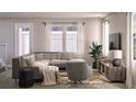 Relaxing living room with L-shaped sectional and stylish decor at 155 Aulin Ave, Oviedo, FL 32765