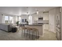 Modern open-concept kitchen with island and breakfast bar at 155 Aulin Ave, Oviedo, FL 32765