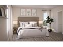 Spacious bedroom with a neutral color palette and stylish decor at 155 Aulin Ave, Oviedo, FL 32765