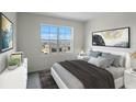 Bright bedroom with a king-size bed and large window at 2526 Sage Valley Way, Winter Haven, FL 33884