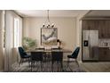 Modern dining room with a large table and dark cabinets at 163 Aulin Ave, Oviedo, FL 32765