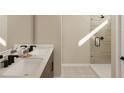 Bathroom boasts double sinks and a walk-in shower at 163 Aulin Ave, Oviedo, FL 32765