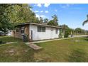 Another view of home's side yard with grassy area at 621 Oaklando Dr, Altamonte Springs, FL 32714