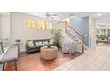 Spacious living room with hardwood floors, a comfy couch, and a window seat at 226 W Tarrington Dr, Deland, FL 32724