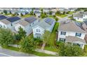 House with solar panels, neighborhood view at 11879 Fiction Ave, Orlando, FL 32832