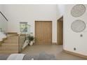 Modern staircase with glass railings and light wood finishes at 830 Oakdale St, Windermere, FL 34786