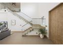 Contemporary floating staircase with glass accents at 830 Oakdale St, Windermere, FL 34786
