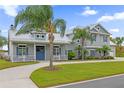Gray two-story house with white shutters and a circular driveway at 6320 S Sylvan Lake Dr, Sanford, FL 32771