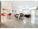 Open concept dining area with breakfast bar at 6742 Pomeroy Cir, Orlando, FL 32810