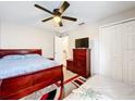 Spacious bedroom with a double bed and ample closet space at 6742 Pomeroy Cir, Orlando, FL 32810