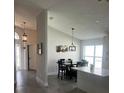 Bright dining area with seating for six and an open concept design at 2521 Oneida Loop, Kissimmee, FL 34747