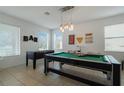 Bright game room with a pool table and foosball table, perfect for entertainment at 4511 Monado Dr, Kissimmee, FL 34746