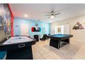Fun game room with pool table, air hockey, and gaming setup at 4537 Target Blvd, Kissimmee, FL 34746