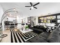 Spacious living room with a large sectional sofa and stylish decor at 4537 Target Blvd, Kissimmee, FL 34746