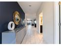 Bright and spacious entryway with modern console at 8896 Cabot Cliffs Dr, Davenport, FL 33896