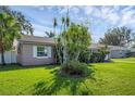 Well-maintained lawn and landscaping in front of a charming single-story home at 2319 Continental Blvd, Orlando, FL 32808