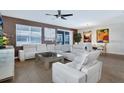 Spacious living room with comfortable seating and large windows at 4535 Narrative Ln, Kissimmee, FL 34746