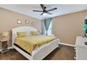 Large bedroom with king-size bed and ample natural light at 4535 Narrative Ln, Kissimmee, FL 34746