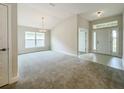 Bright dining room with carpet flooring and large windows at 4394 Sagefield Dr, Harmony, FL 34773
