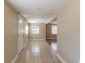 Bright entryway with tiled floors and neutral walls at 1506 W 16Th St, Sanford, FL 32771