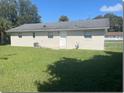 Spacious backyard with grassy lawn, providing ample outdoor space at 512 W Ella J Gilmore St, Apopka, FL 32703