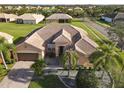 Single-Gathering home with tile roof and palm trees in a residential neighborhood at 3623 Weatherfield Dr, Kissimmee, FL 34746