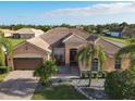 Single-Gathering home with tile roof and palm trees in a residential neighborhood at 3623 Weatherfield Dr, Kissimmee, FL 34746