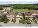 Aerial view of a house in a residential neighborhood at 348 Sand Ridge Dr, Davenport, FL 33896