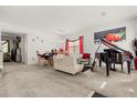 Spacious living room featuring a piano and comfortable seating at 348 Sand Ridge Dr, Davenport, FL 33896
