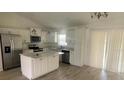 Modern kitchen with island and stainless steel appliances at 13394 Sw 106Th St, Dunnellon, FL 34432