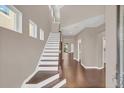 Bright entryway with hardwood floors and staircase at 8795 Ribault Ave, Orlando, FL 32832