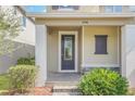 Front entrance with double doors and a stone accent at 8795 Ribault Ave, Orlando, FL 32832