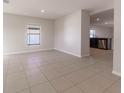 Bright and spacious living room with tile floors at 207 Goldenrod Ln, Kissimmee, FL 34759