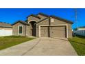 Newly built home with two-car garage at 207 Goldenrod Ln, Kissimmee, FL 34759